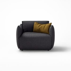 The Hearth Armchair by Ross Gardam is the epitome of comfort and style, designed to be the new heart of your home. The slightly upturned edges of the armchair upholstery are a unique design feature that adds a refined artistic flair - Front view in Navy Fabric.